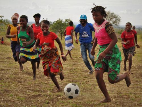 Displaced and host community girls play football in Cabo Delgado, Mozambique as part of the World Refugee Day celebrations. 
