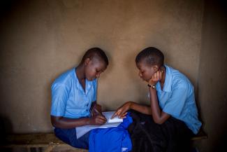 Anethe Cyuzuzo (left), 15, from Rwanda, and Irikungoma Bellaca (right), 16, from Burundi at Paysannat L school, in Mahama refugee camp, Kirehe, eastern Rwanda.