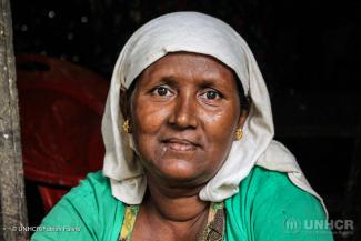 Makhin Nu, 45, sits in front of her makeshift shelter in Say Tha Mar Gyi, a camp that is home to 16,500 Rohingya internally displaced people in Rakhine state, Myanmar.