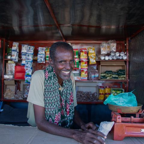 A man selling in a shop