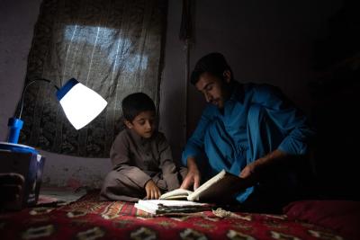 An Afghan Refugee family benefits from Solar lanterns for Short-Term Energy Solution in New Saranan refugee village, Balochistan, Pakistan. © UNHCR/Mercury Transformations