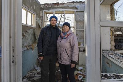 Woman standing with her son.