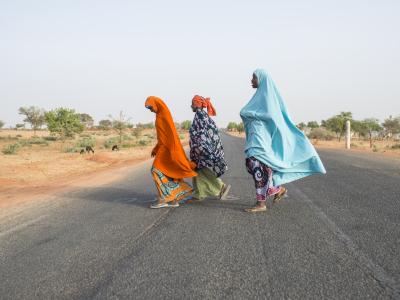 women crossing a street