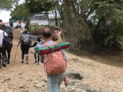 man carrying her daughter