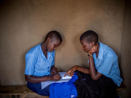 Anethe Cyuzuzo (left), 15, from Rwanda, and Irikungoma Bellaca (right), 16, from Burundi at Paysannat L school, in Mahama refugee camp, Kirehe, eastern Rwanda.