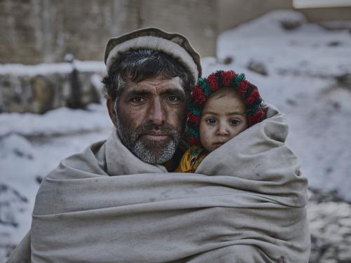 A father and a child in blanket
