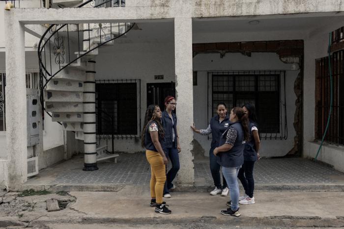 Women standing in front of a building