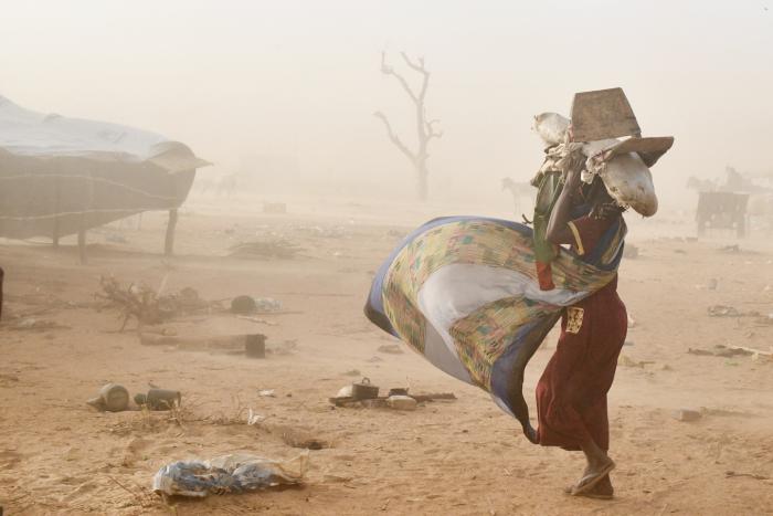 In Amdafock, a sudanese refugee seeks refuge during a sand storm. Thousands of Sudanese forcibly displaced crossed the Central African Republic border since the month of April, fleeing violence in Darfur. © UNHCR/Xavier Bourgois