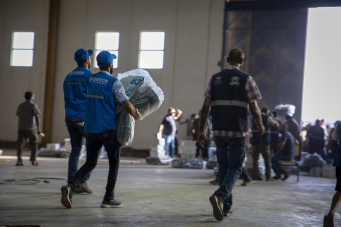 UNHCR teams distribute hygiene kits, blankets, and other relief items to families displaced by the floods in Al Marj, eastern Libya. At least 4,000 people have died as a result of Storm Daniel, with thousands still missing and more than 40,000 people displaced. © UNHCR/Ziyad Alhamadi