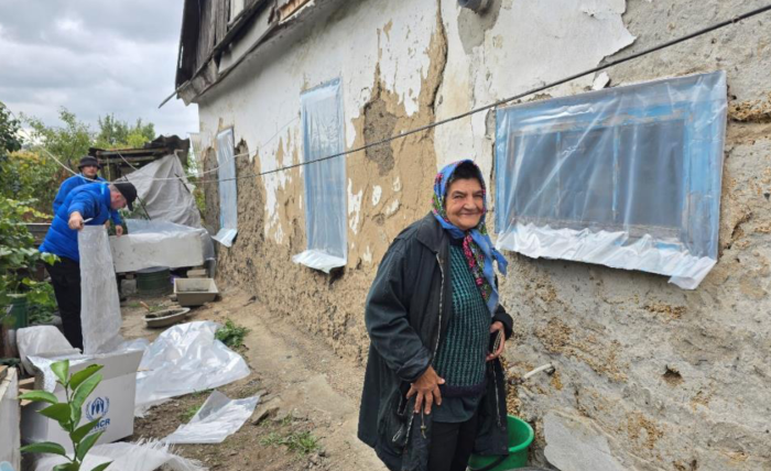 woman standing in front of house