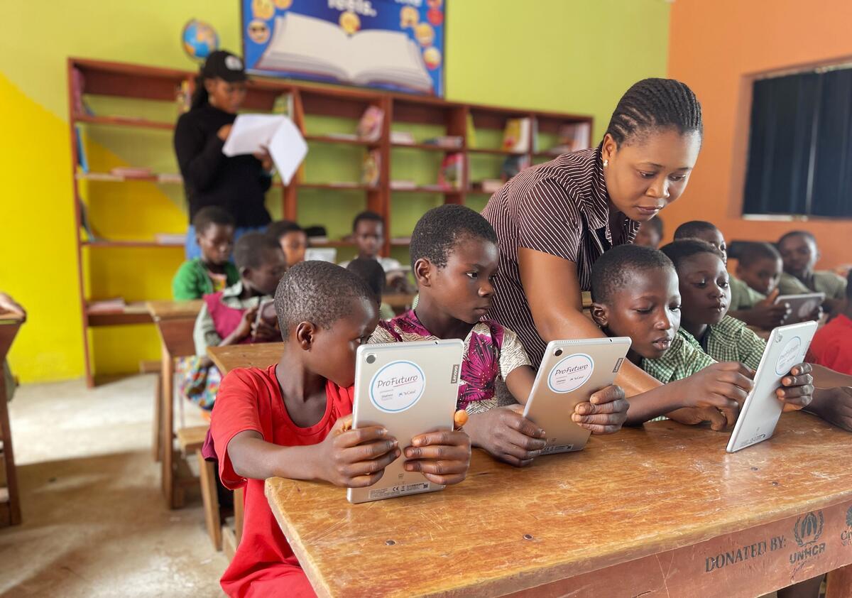 students in classroom using tablets