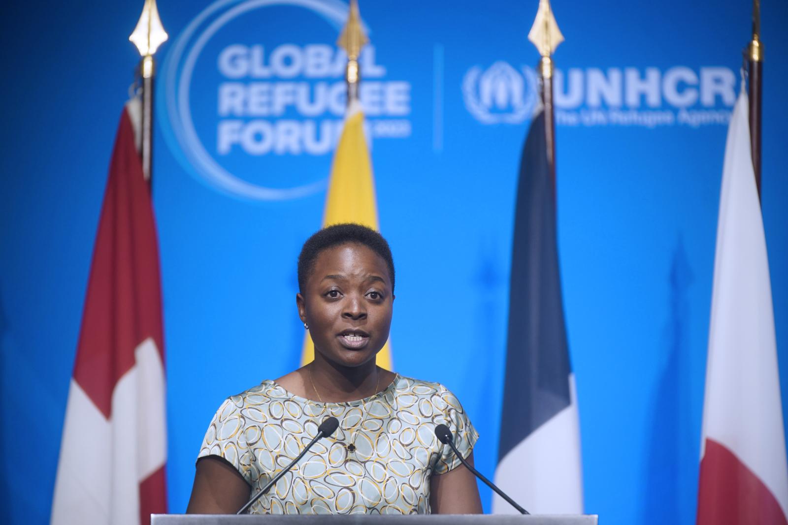 woman speaking on podium