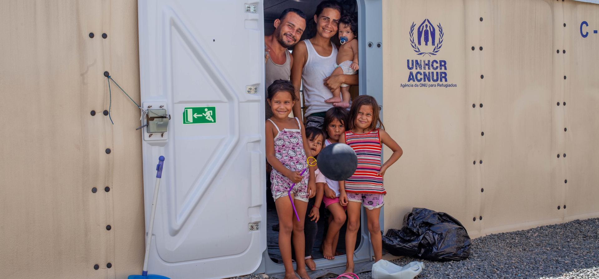 People standing in a plastic house