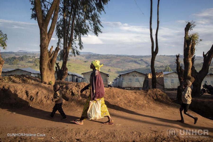Emmanuelle walks her children three kilometres to school in Bulé town in the Democratic Republic of the Congo. They fled their home from when armed men attacked. Emmanuelle says her children are hungry and feel humiliated having to go to school barefoot.  