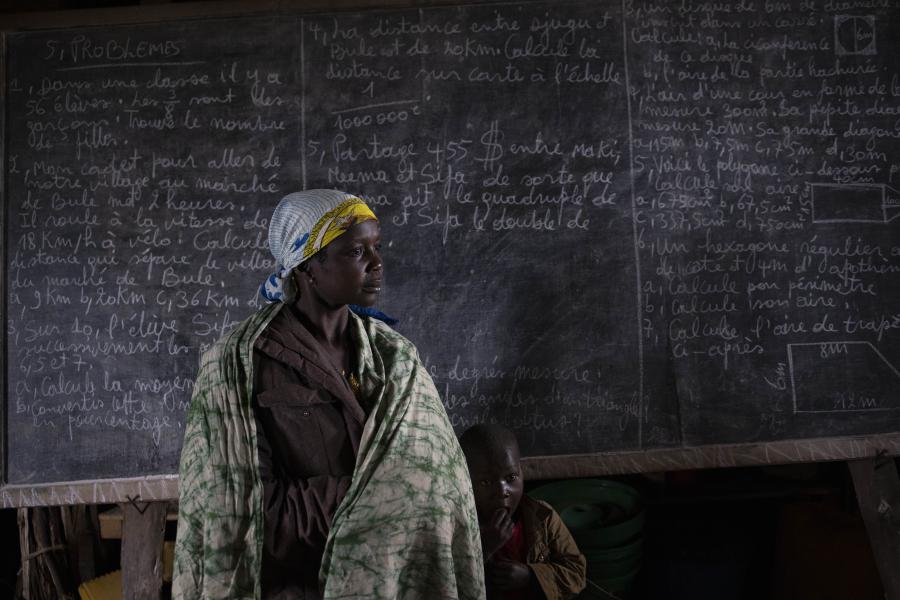 Clarisse, 30, and her son have been spending the nights in this classroom in Bulé since 2021, after they fled attacks on their village. She has four other children who stay in another room at night. “I only have the clothes I’m wearing on me, I have no other clothes. I have a sauce-pan and a plastic bucket. These are all my possessions. It is cold at night. If only we had more blankets”. The school hosts 1,500 displaced people who sleep on bags or plastic sheets spread on the floor at night.