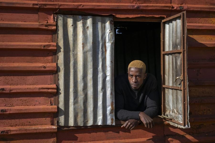 A man looking over the window