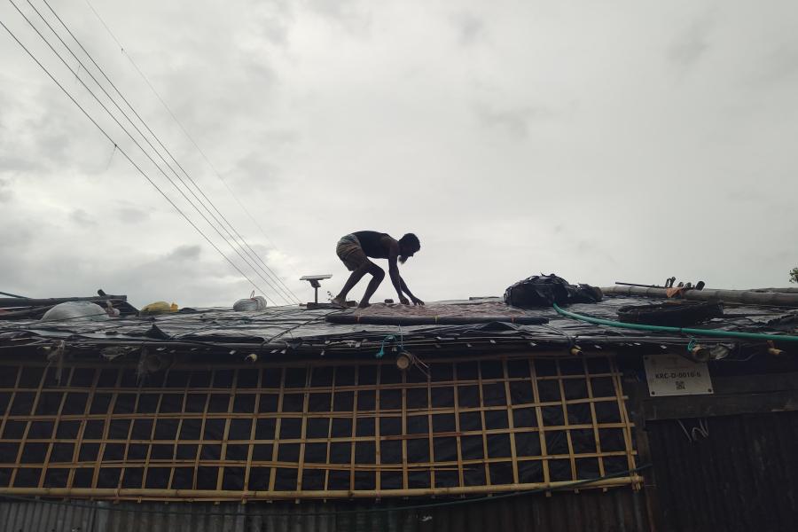 A man fixing a shelter
