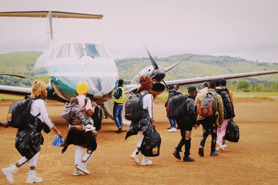 A family boarding a plane