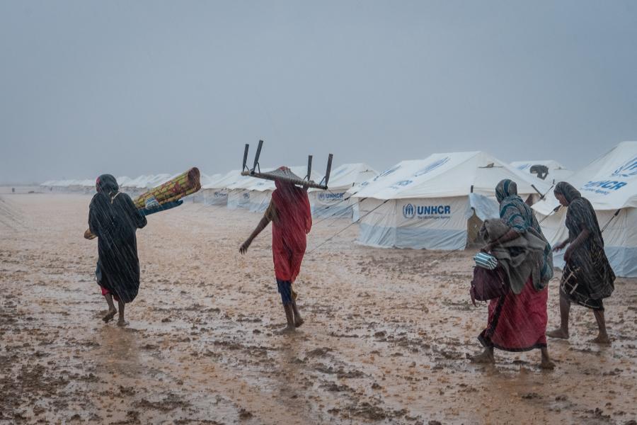 people walking in the rain
