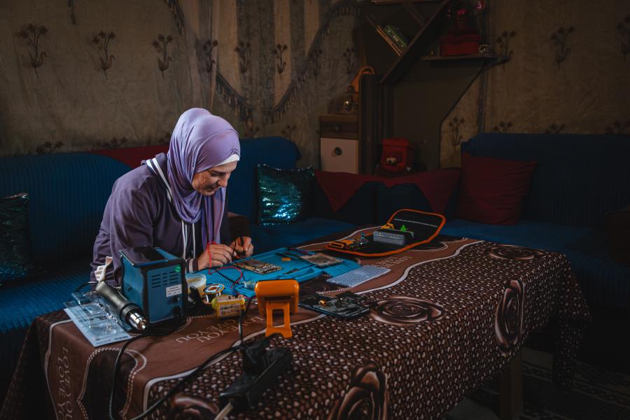 A woman fixing phones
