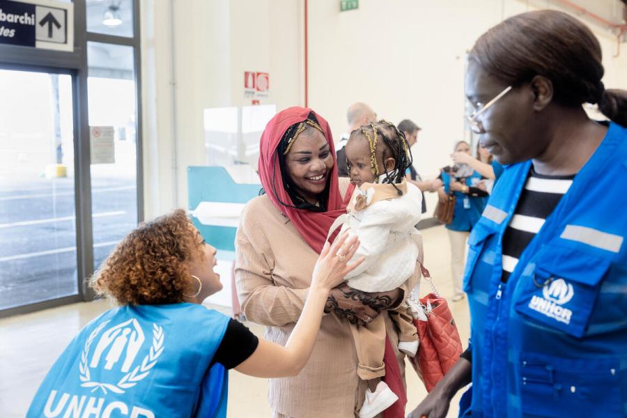 UNHCR staff welcoming refugees