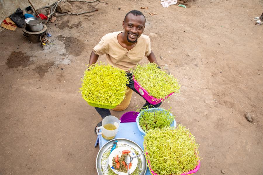 A man with vegetable baskets