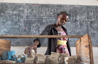 Internally displaced Congolese woman, Assy, 25, attends soap-making class where she is recovering from gender-based violence