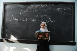 Shakila, a displaced 7 year-old, rehearsals a class lesson in Kahdistan Secondary School in Injil district of Herat province on November 2, 2020.