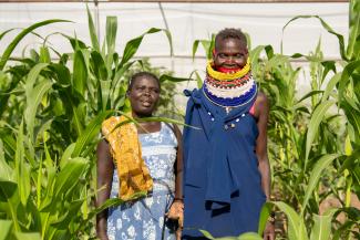 A Turkana host community woman poses with her friend from South Sudan at the Horticulture Farm in Kalobeyei settlement.
