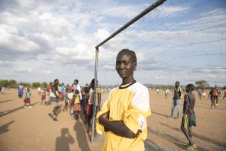 Margaret Monday Dominic, 15, as a goalkeeper on an all-girls football team. She is a student at Bhar-El-Naam Girls Primary School in Kakuma Refugee Camp, Kenya.