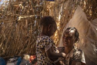 Ethiopian refugee, Ngesti Gudamadhen, 28, is living with her husband, Asmelash Alemayoh, 33, their son Arbil Asmelash, 7, and their daughter Adiam Asmelash, 2, in a shelter in Um Rakuba camp, Sudan. She is a volunteer teacher in the camp. 