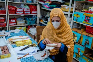Saira is a refugee women from Afghanistan, and a senior trained artisans working in the Artisan Links Office to finalize the crafting products. 