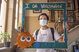 Abdallah Yasser, a refugee from the Syrian Arab Republic, gets vaccinated against COVID-19 in Alexandria, Egypt.