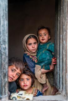 kids looking from a window