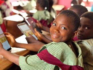 girls studying with tablets