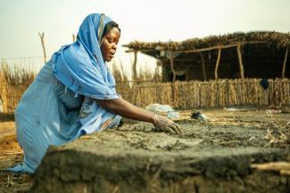 woman building her own shelter