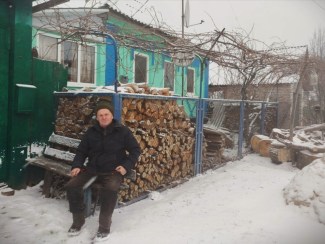man sitting on a bench in winter